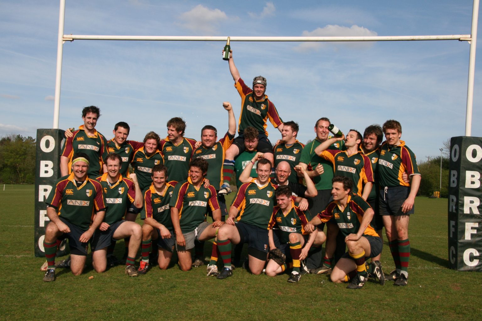 OBS rugby team celebrating under the posts